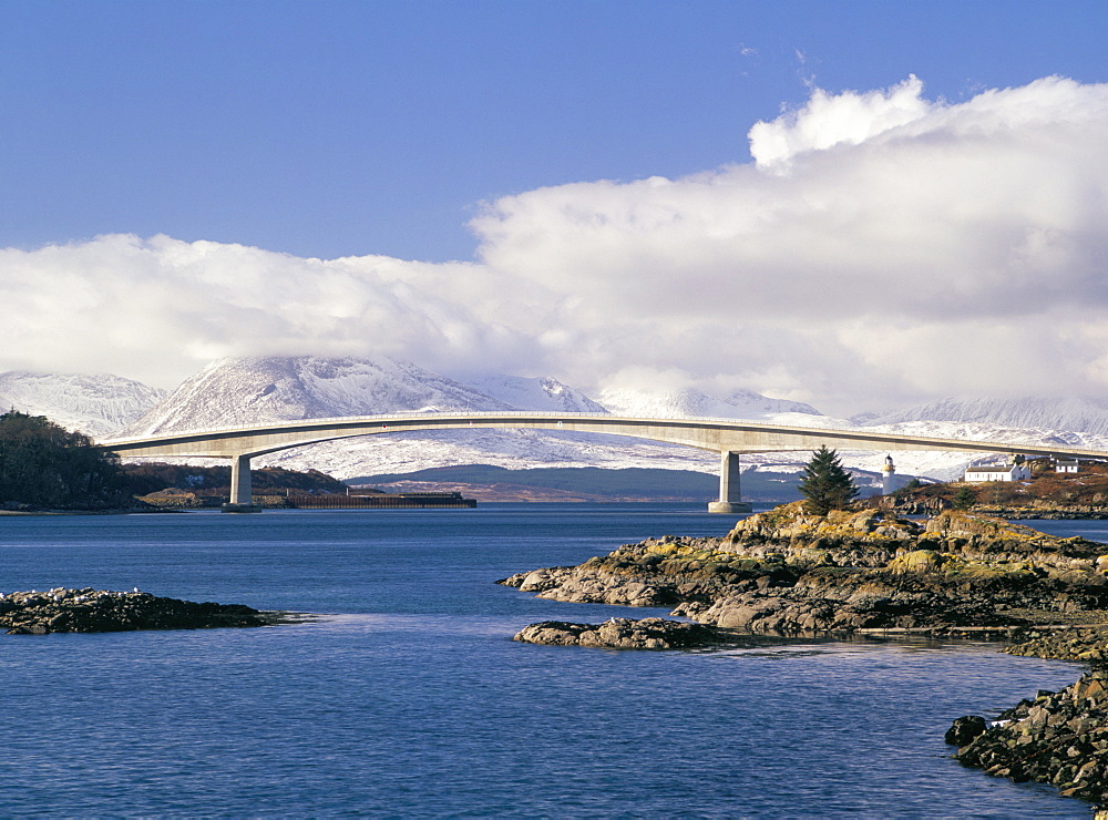 Skye bridge across Kyle Akin with snow on the mountains of Skye in late winter, Kyle of Lochalsh, Highland Region, Scotland, United Kingdom, Europe