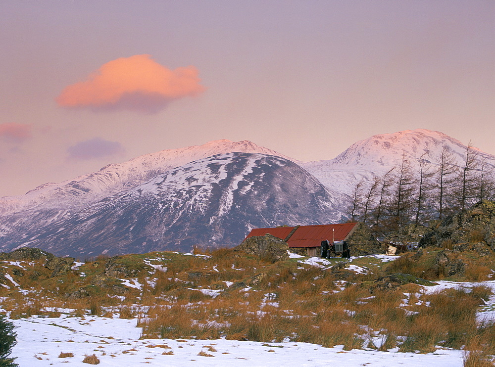 Dawn light on the mountains of Skye from Galltair on the mainland, with a red roofed barn and snow on the ground in late winter, Glenelg, Highland region, Scotland, United Kingdom, Europe