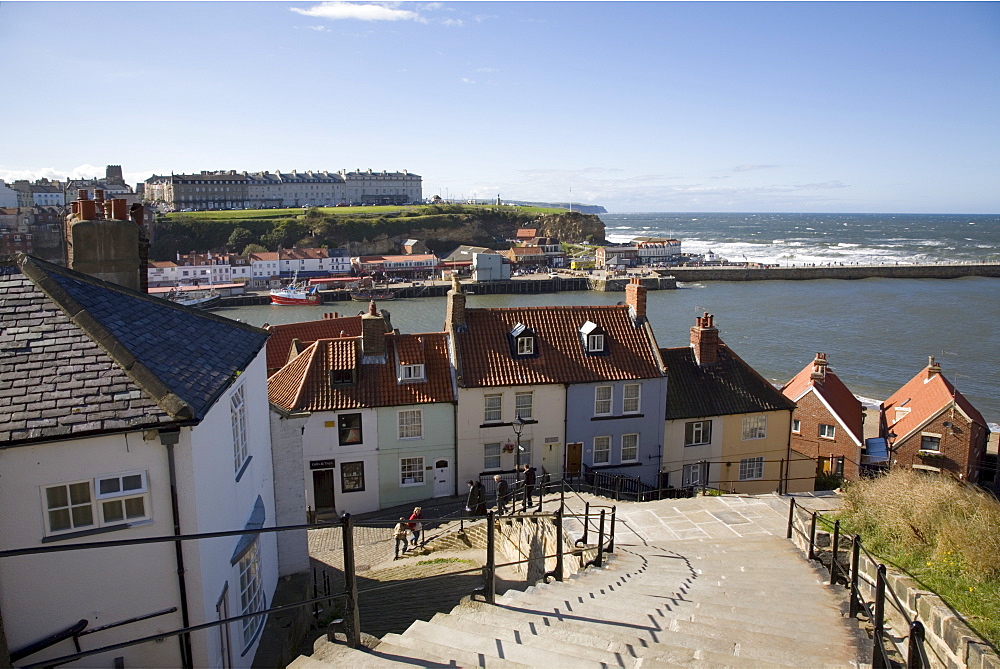 Old Town and River Esk harbour from steps on East Cliff, with West Cliff beyond, Whitby, Heritage Coast of North East England, North Yorkshire, England, United Kingdom, Europe