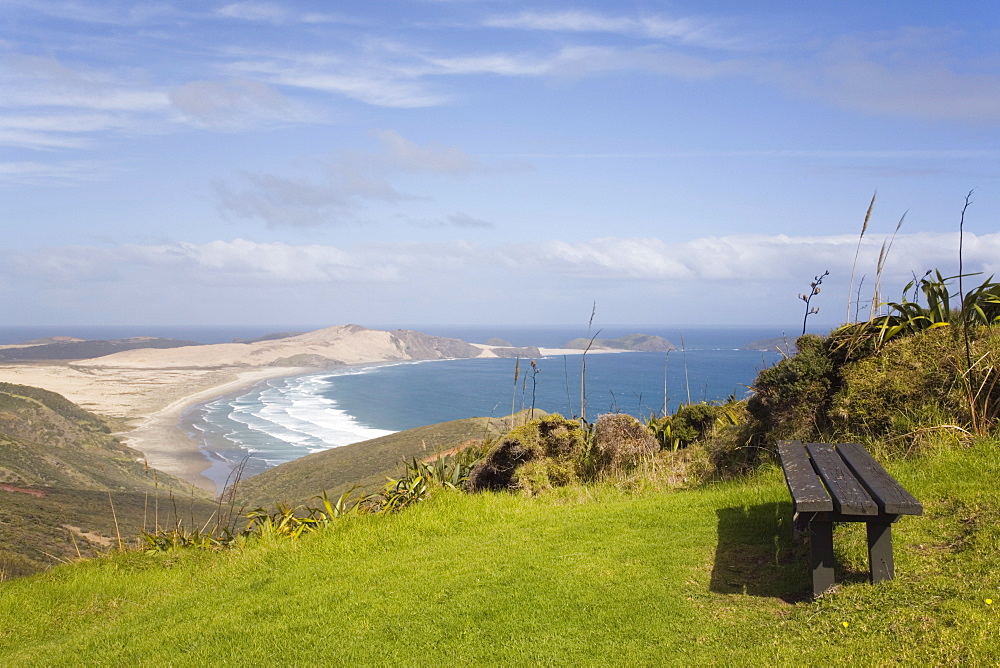 Bench by Cape Reinga Coastal Walkway on cliff top with view to Te Werahi Strand beach and Cape Maria Van Diemen Point, Aupori Peninsula, Northland, North Island, New Zealand, Pacific