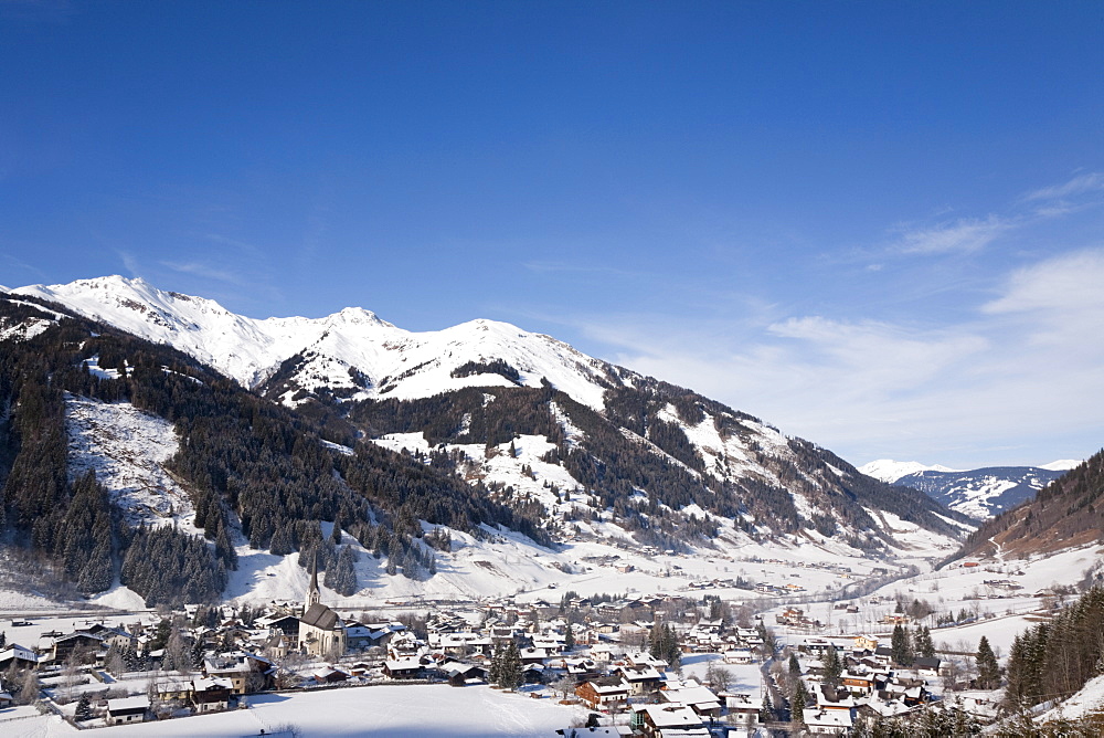 Alpine ski resort in Austrian Alps with snow in Rauriser Sonnen Valley and on Sonniblick Mountains in winter, Rauris, Austria, Europe