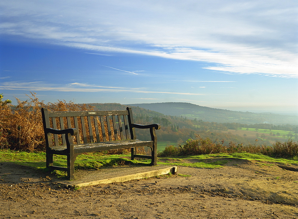 Bench on Pitch Hill, with view along the Greensand Ridge to Holmbury Hill and Leith Hill, Pitch Hill, Ewhurst, Surrey, England, United Kingdom, Europe