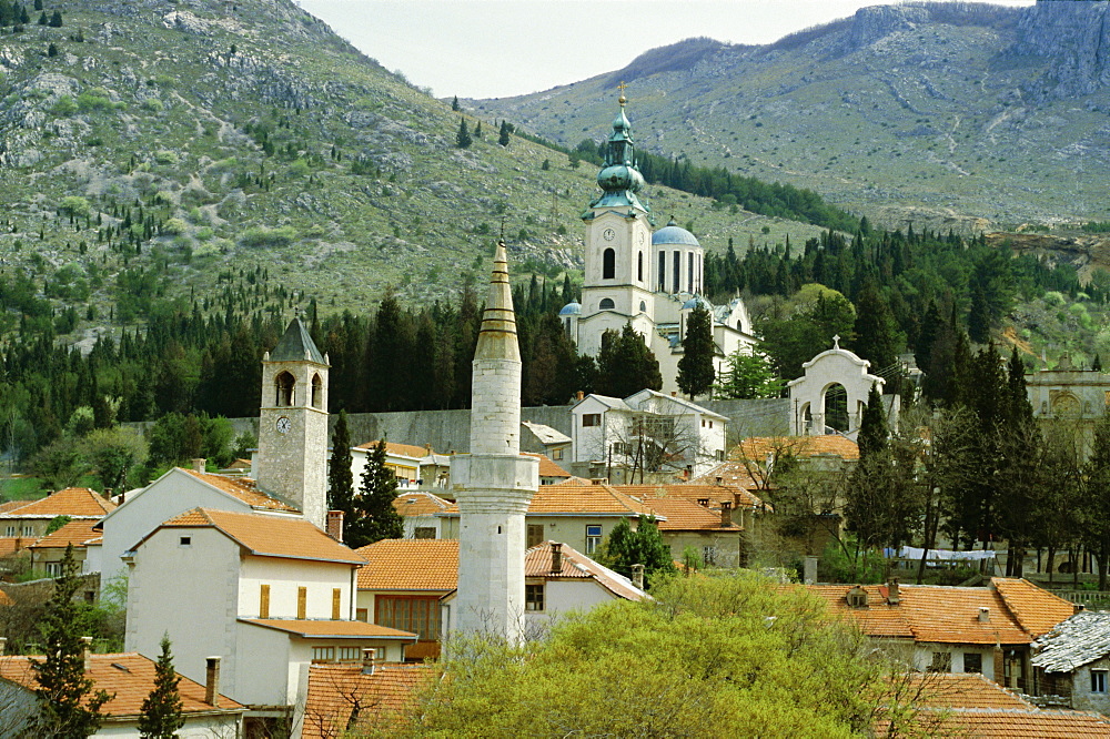 Minarets and church towers symbolise religions of former Turkish town, Mostar, Bosnia Herzegovinia, Europe