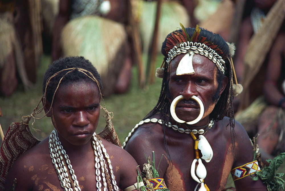 Portrait of a man and wife with bone and cowry shell jewellery and decoration at a Sing-sing in Papua New Guinea, Pacific Islands, Pacific