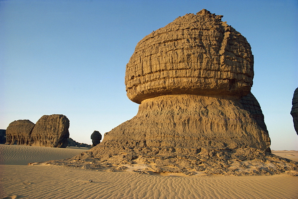 Wind eroded pinnacle rock showing strata, Tamegaout, Algeria, North Africa, Africa