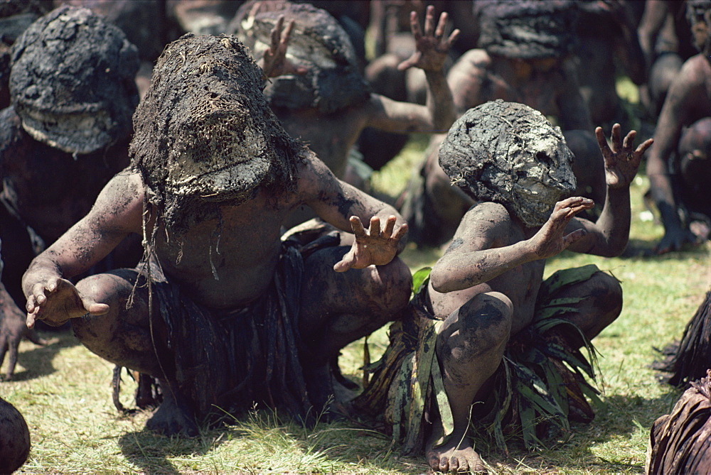 Mud men wearing clay masks perform ritual dance, Asaro Valley, Papua New Guinea, Pacific Islands, Pacific