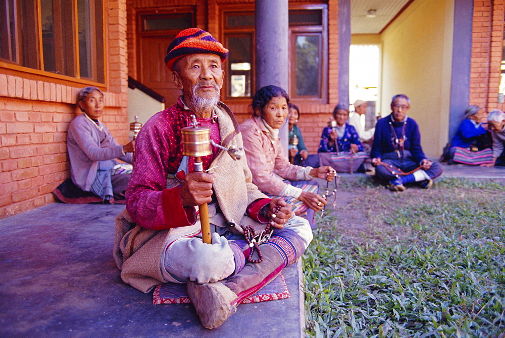 Karma Lobsang Tibetan man spinning prayer wheel, Tashiparkhel Tibetan camp, Pokhara, Nepal