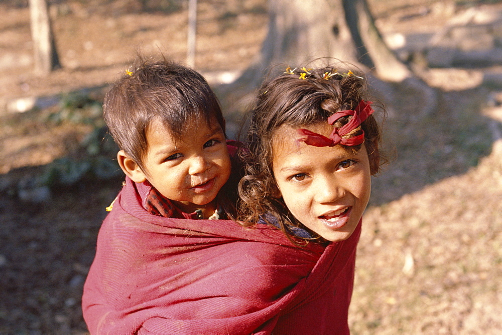 Head and shoulders portrait of two children, Kathmandu, Nepal, Asia