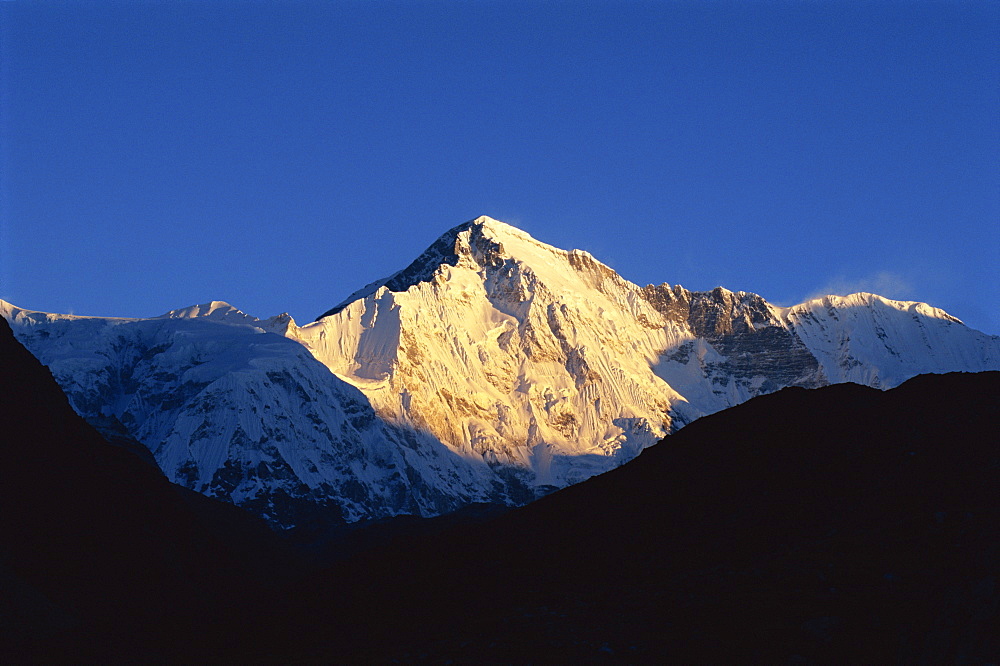 Sun on snow-capped high mountain peaks, Himalayas, Nepal, Asia