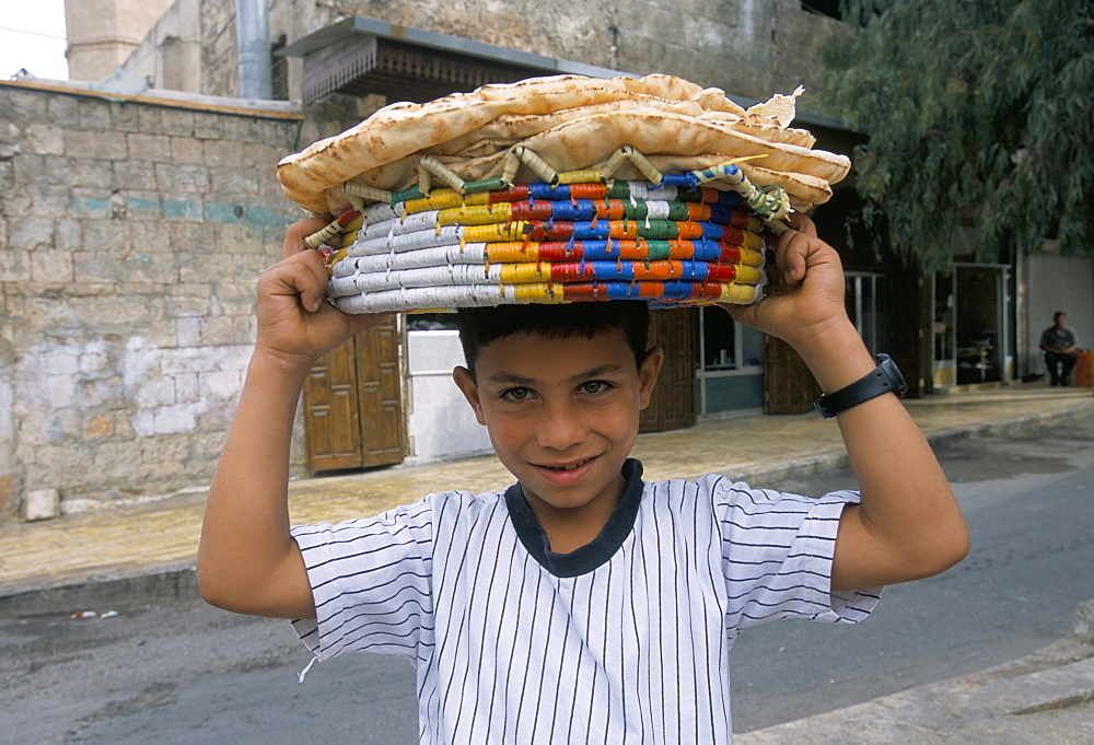 Boy selling bread in the Armenian area, Aleppo, Syria, Middle East