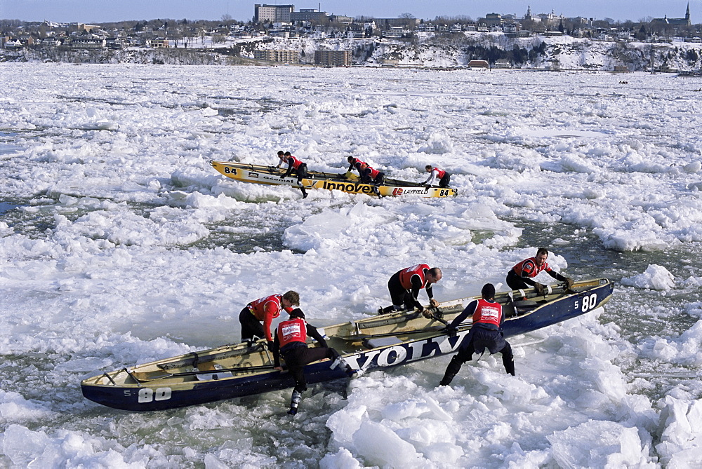 Ice canoe races on the St. Lawrence River during winter carnival, Quebec, Canada, North America