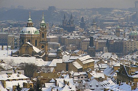 Skyline of the city of Prague in the winter, with snow on the roofs, Czech Republic, Europe