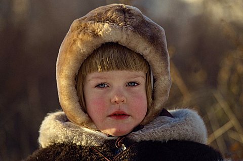 Head and shoulders portrait of young Russian girl wearing a fur hat, looking at the camera, Moscow, Russia, Europe