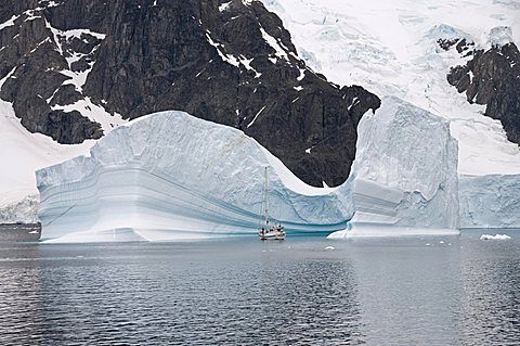 Sailing yacht and iceberg, Errera Channel, Antarctic Peninsula, Antarctica, Polar Regions