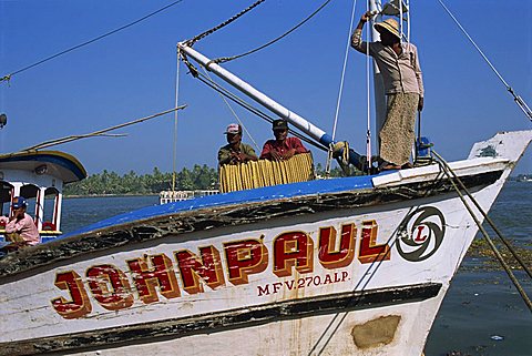 Fishermen on fishing boat, Cochin harbour, Kerala, India, Asia