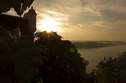 Sunset over the Goan coastline viewed from Fort Tiracol, Goa, India, Asia