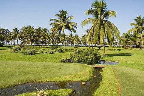 The garden and golf course at the Leela Hotel, Mobor, Goa, India, Asia