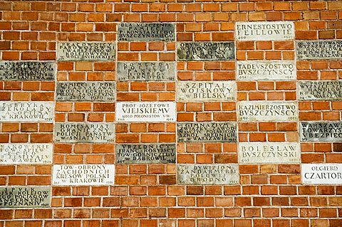 Names in the wall on way up to the Royal Castle area and Wawel Catherdral, Krakow (Cracow), UNESCO World Heritage Site, Poland, Europe