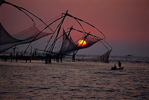 Fishing nets at sunset, Cochin, Kerala state, India, Asia