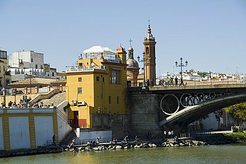 Puente de Isabel II, also known as Puente de Triana, with Triana district on left and the river Rio Guadalquivir, Seville, Andalusia, Spain, Europe