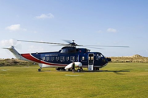 Helicopter at Tresco heliport, Tresco, Isles of Scilly, off Cornwall, United Kingdom, Europe