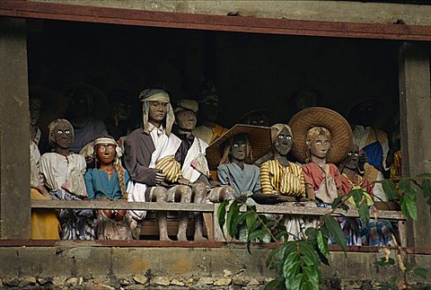 Effigies of the dead, Lemo cliff tombs, Toraja area, island of Sulawesi, Indonesia, Southeast Asia, Asia