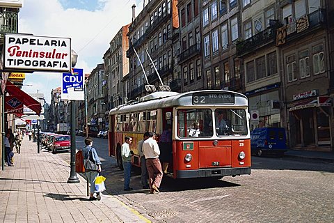 Street scene of people getting on a trolley bus in the city of Oporto (Porto), Portugal, Europe