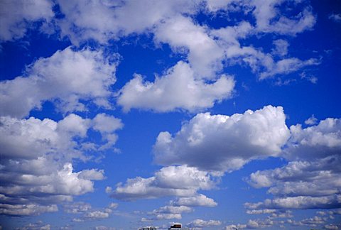 Blue sky and puffy white clouds