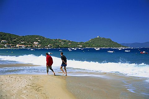 Two walkers on the beach, Campo Moro, Corsica, France, Mediterranean, Europe