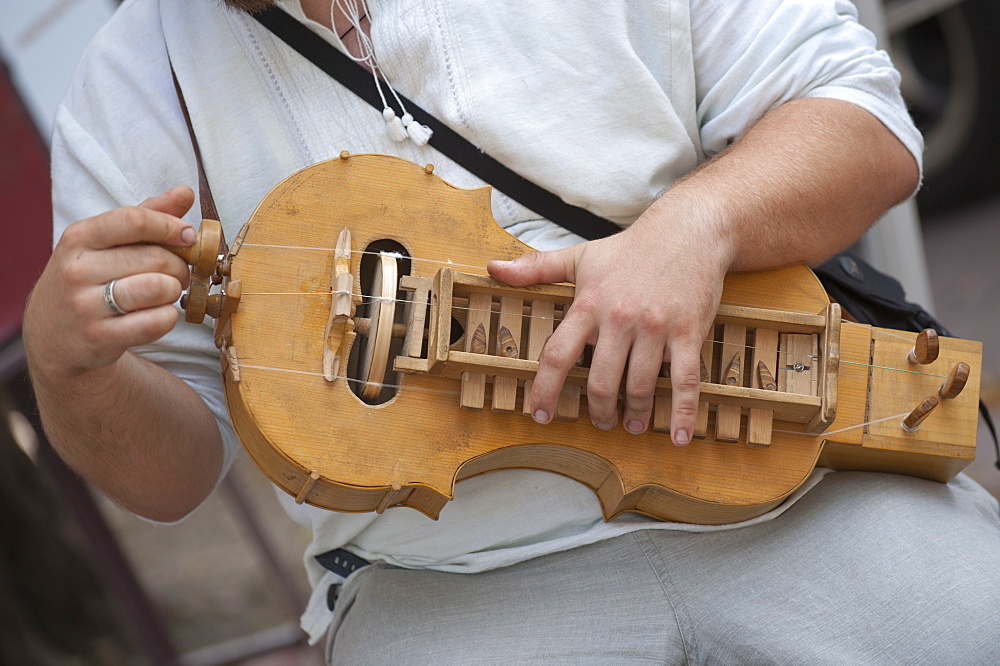 A man plays a Lira, a traditional Russian musical instrument, Kiev, Ukraine, Europe