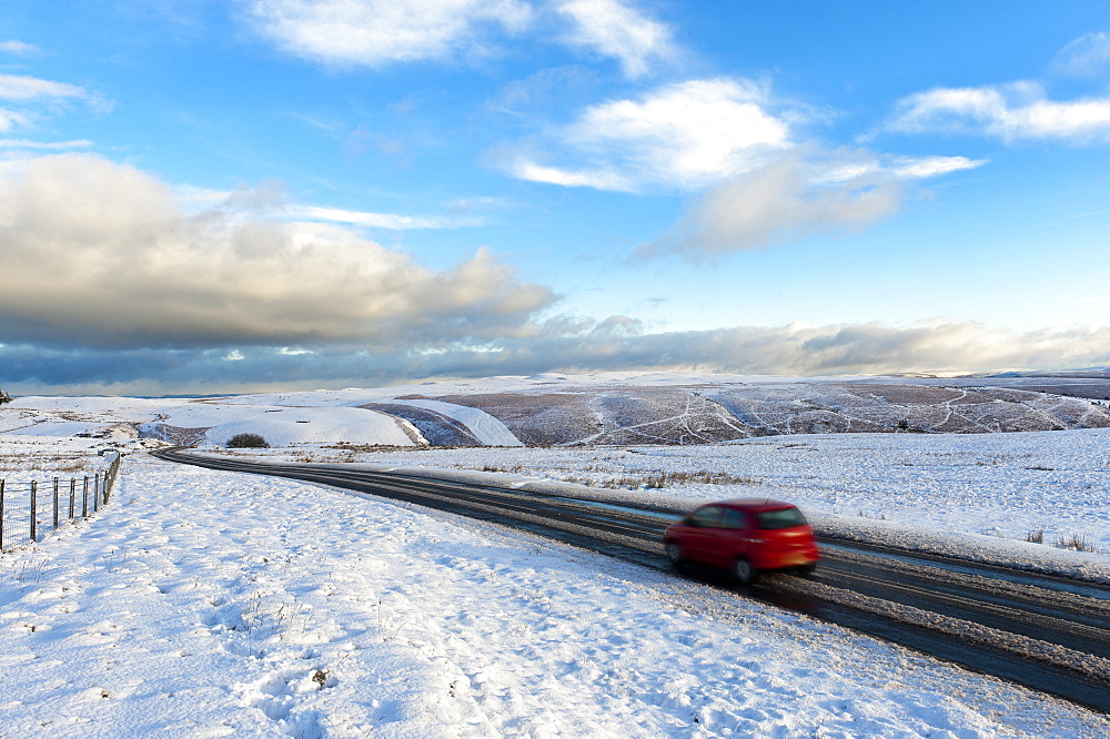 Motorists negotiate the B4520 road between Brecon and Builth Wells on the Mynydd Epynt moorland, Powys, Wales, United Kingdom, Europe