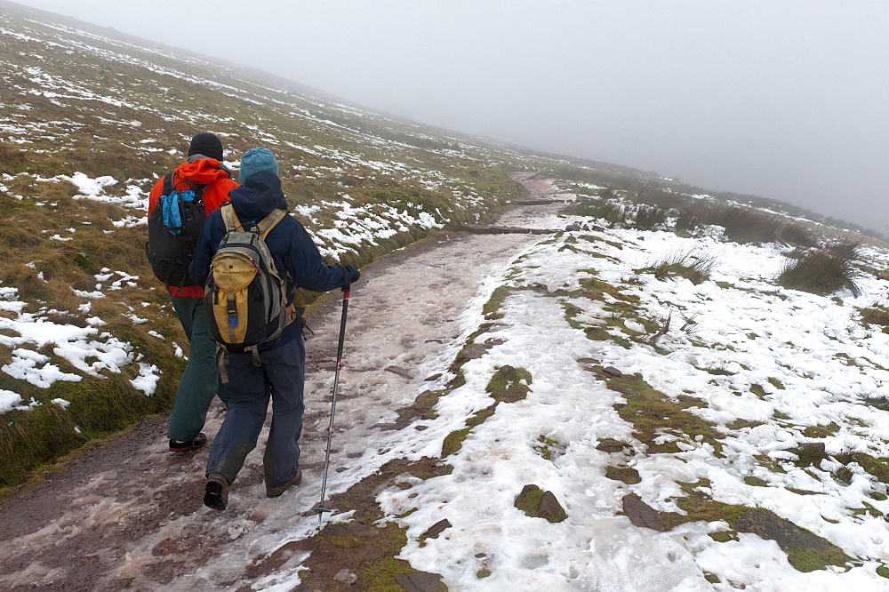 Hikers descend from Pen-Y-Fan summit in The Brecon Beacons National Park, Powys, Wales, United Kingdom, Europe