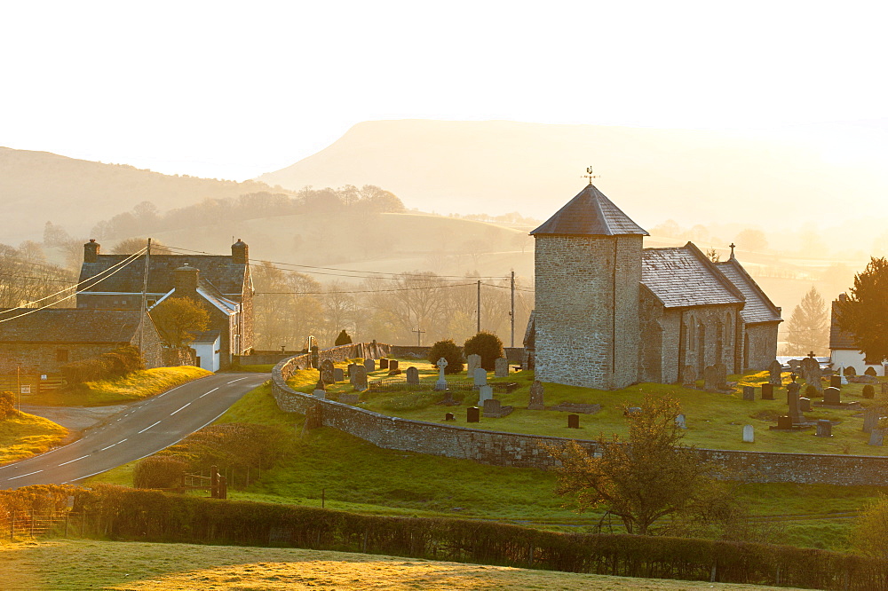 A view at sunrise of St. David's Church in the tiny hamlet of Llanddewi'r Cwm, Powys, Wales, United Kingdom, Europe