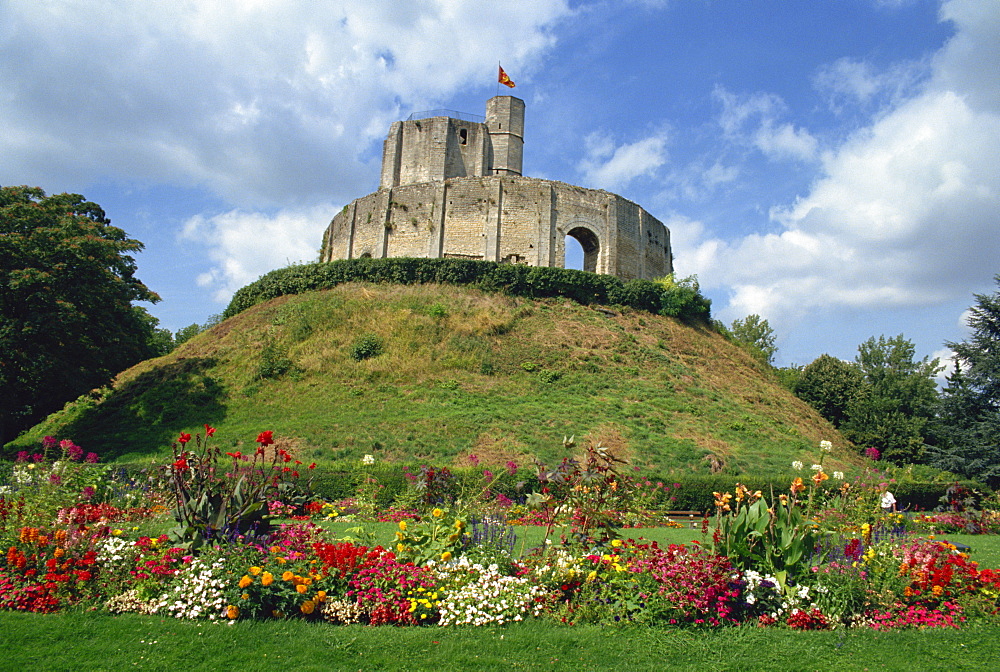 Exterior of 11th century castle on mound at Gisors with flower border below, in Haute Normandie (Normandy), France, Europe