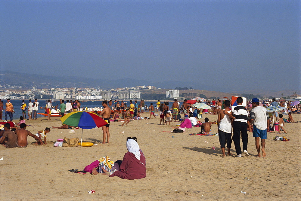 People on the main sandy beach at Tangiers, Morocco, North Africa, Africa