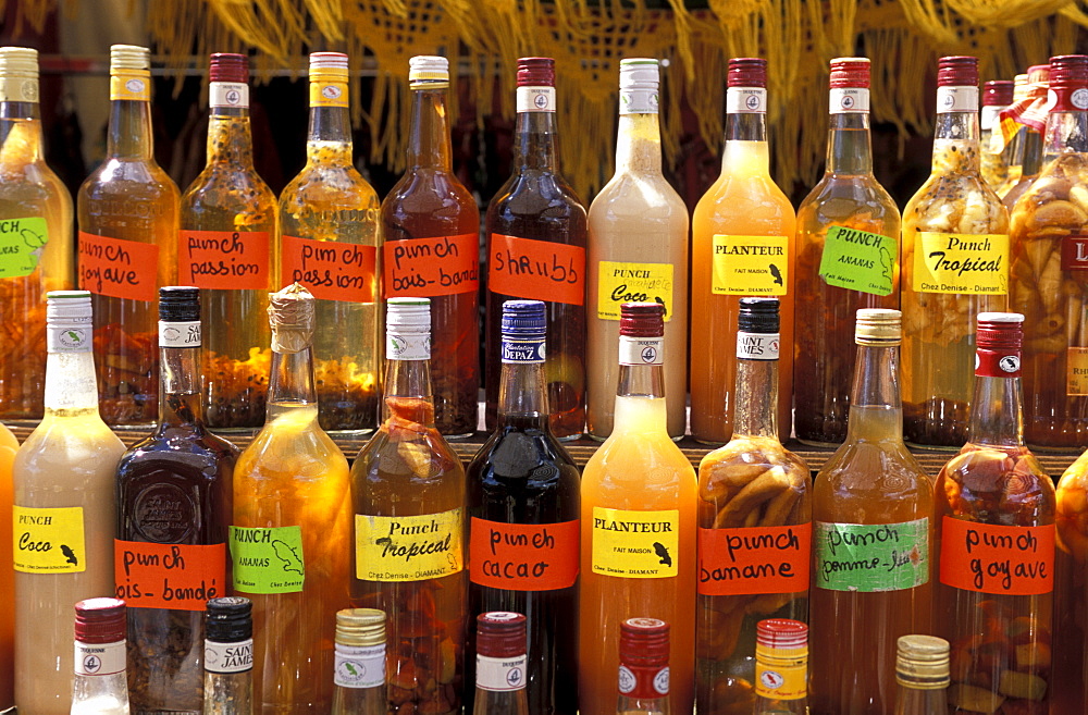 Bottles of local rum drinks at Le Diamant village, Martinique, West Indies, Caribbean, Central America