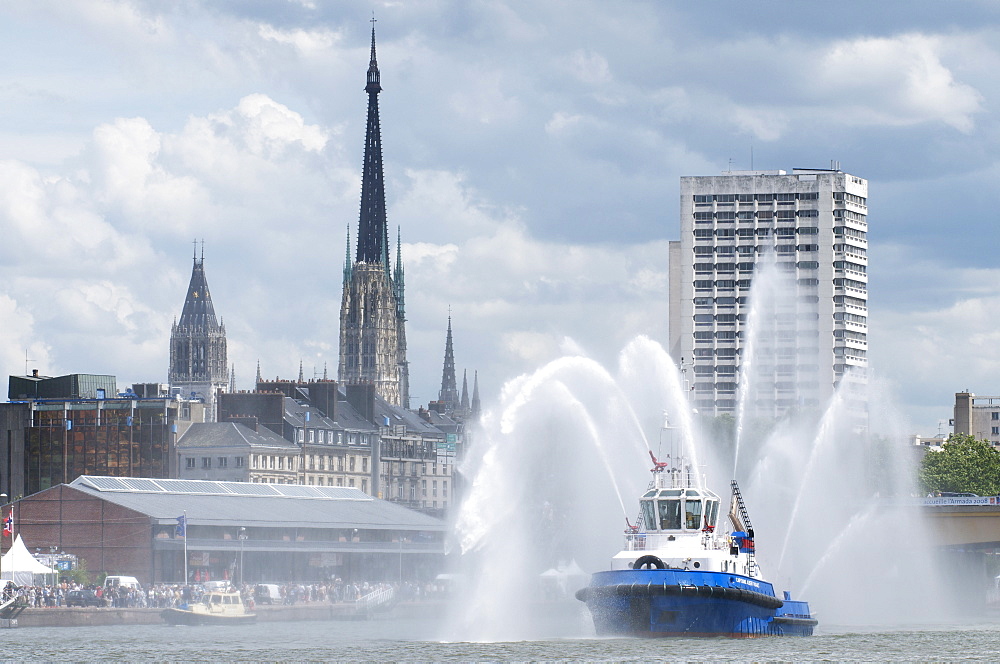 Fires boats on River Seine and Rouen cathedral behind, Rouen, Normandy, France, Europe