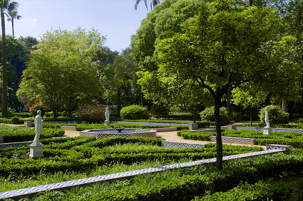 Statues and flower beds, Maria Luisa park, Seville, Andalusia, Spain, Europe