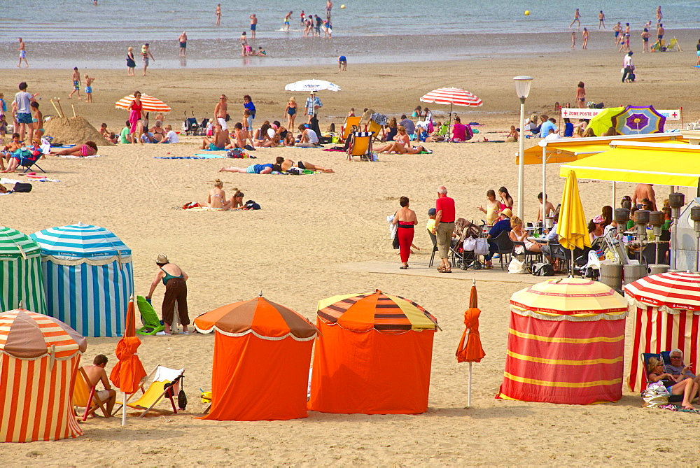 Typical color striped beach cabins, tourists, beach and sea, Trouville sur Mer, Normandy, France, Europe