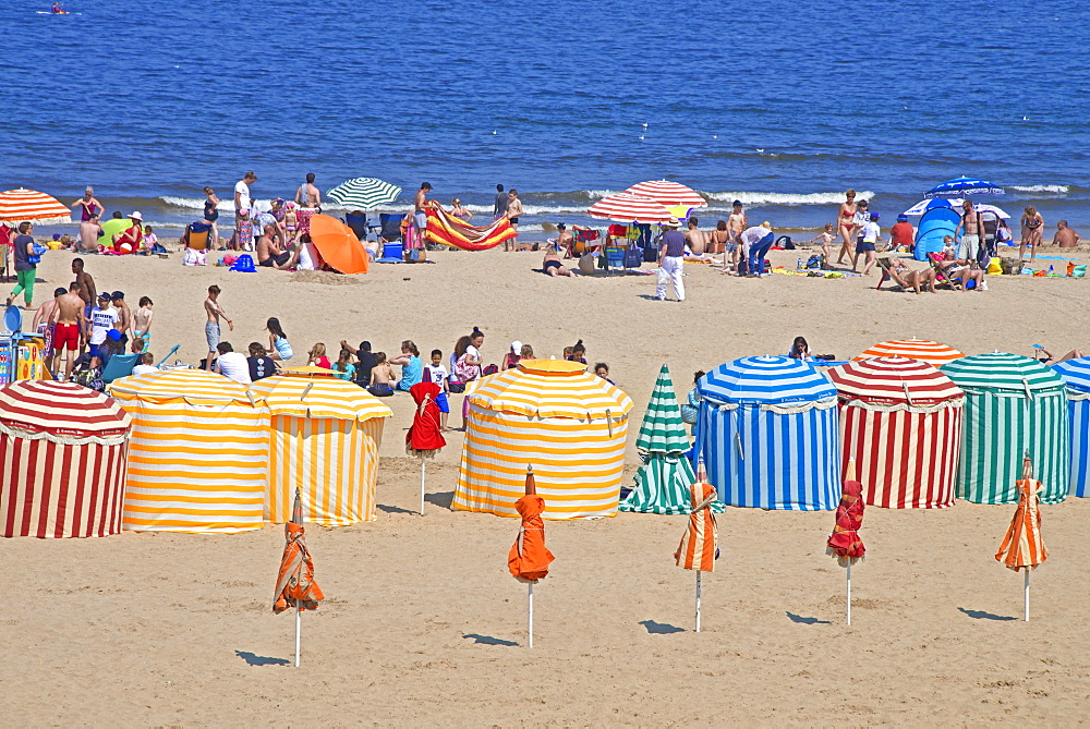 Typical color striped beach cabins, tourists, beach and sea, Trouville sur Mer, Normandy, France, Europe