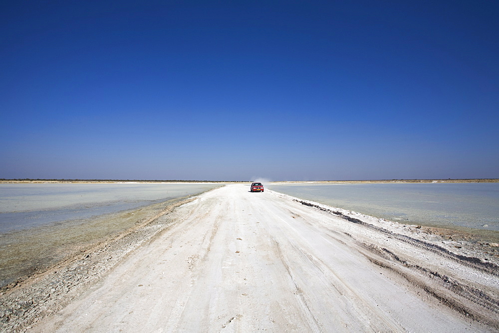 Vehicle on track into Etosha Pan, Etosha National Park, Namibia, Africa