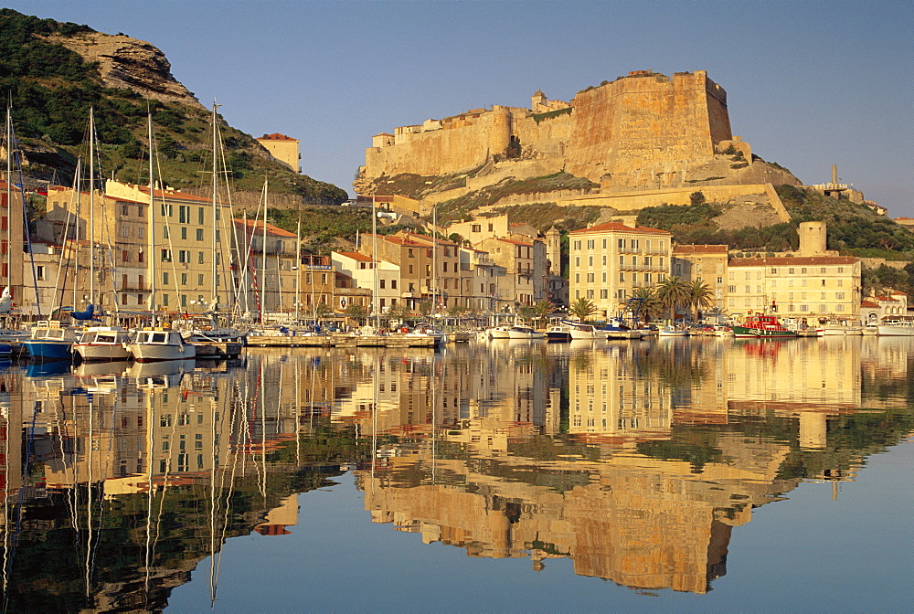 Yachts moored in the harbour, with the citadel behind, Bonifacio, Corsica, (France) 