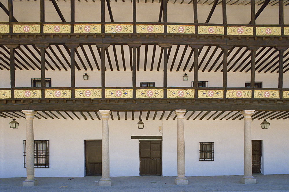 Columns and verandah on a building on the Plaza Mayor in Tembleque in Castile la Mancha (Castilla la Mancha), Spain, Europe