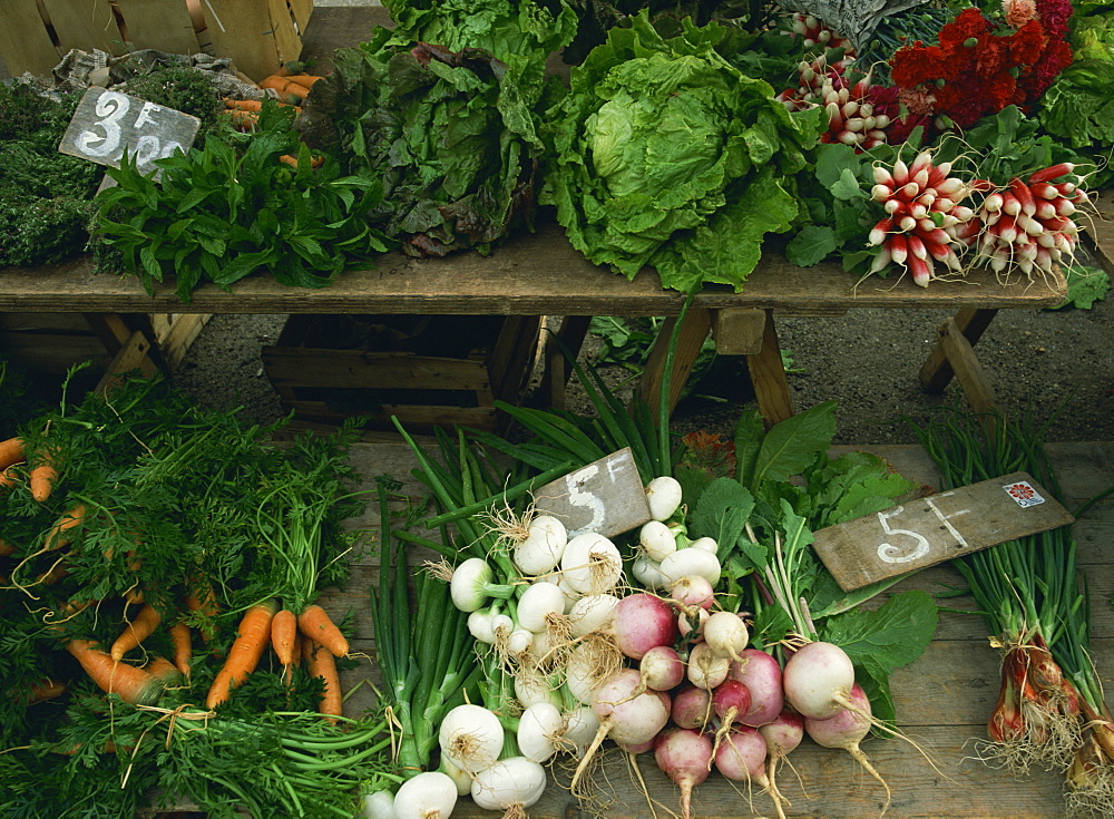 Display of salad items and vegetables for sale in a market in Aquitaine, France, Europe