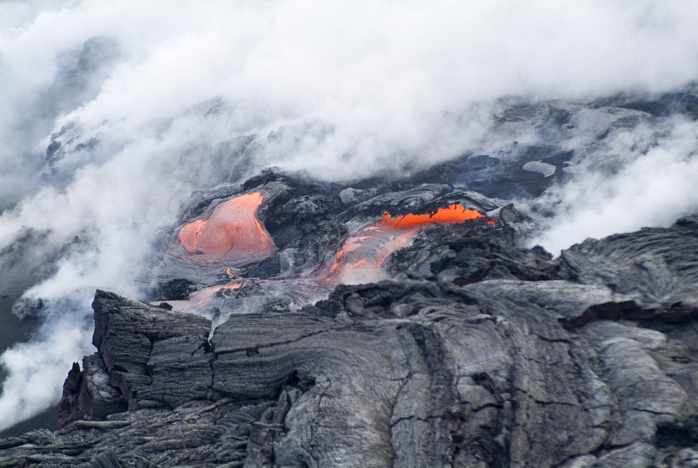 Steam plumes from hot lava flowing onto beach and into the ocean, Kilauea Volcano, Hawaii Volcanoes National Park, UNESCO World Heritage Site, Island of Hawaii (Big Island), Hawaii, United States of America, North America