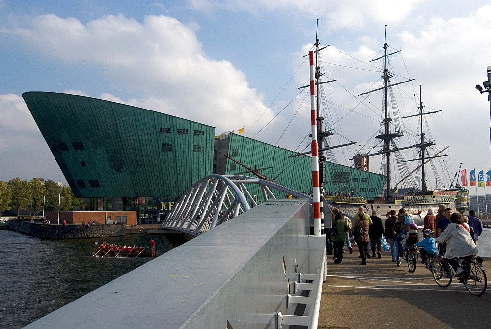 NEMO, the new science and technology museum and the VOC ship from the Maritime Museum, Eastern Docks, Amsterdam, Netherlands, Europe