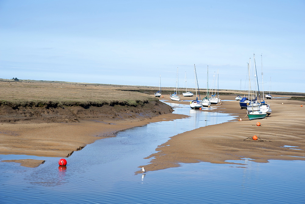 View of the harbour at low tide, morning, Wells-next-the-Sea, North Norfolk, England, United Kingdom, Europe