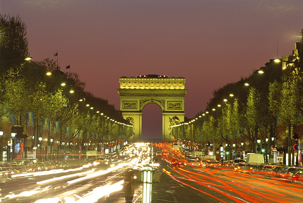 Avenue des Champs Elysees and the Arc de Triomphe at night, Paris, France, Europe