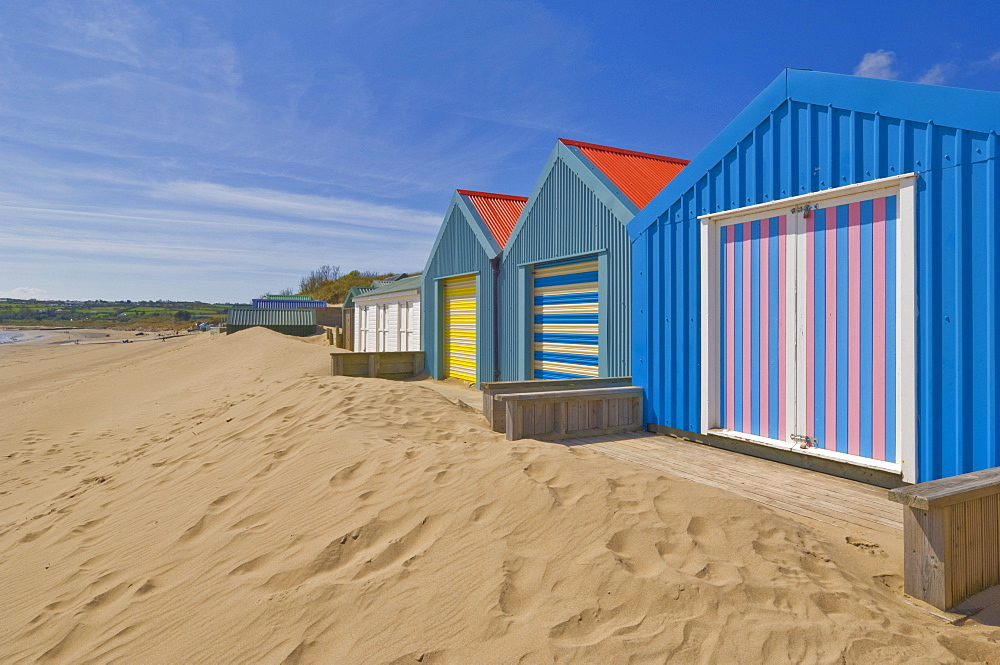 Multicoloured beach huts in the dunes on the long sweeping Morfa Gors beach, Borth fawr, St Tudwal's road at Abersoch, Llyn Peninsula, Gwynedd, North Wales,Wales, United Kingdom, Europe