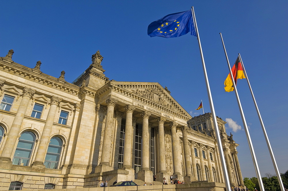 The EU and German national flags flying outside the famous Reichstag parliament building, Berlin, Germany, Europe